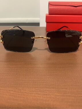 Cartier Black Lens Sunglasses with Gold Bridge